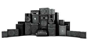 A tower of audio monitors and enclosed speakers
